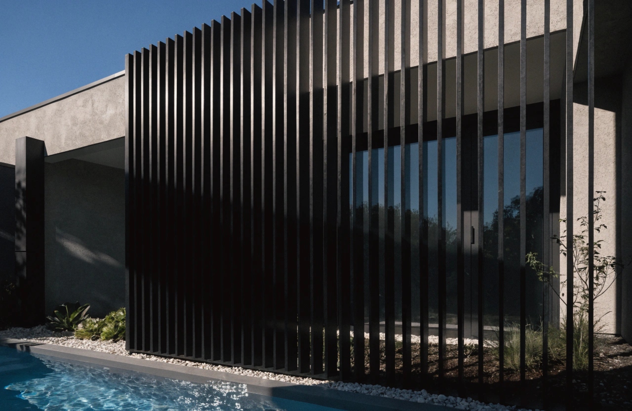 Aluminium slat privacy screen enclosing a pool entertaining area